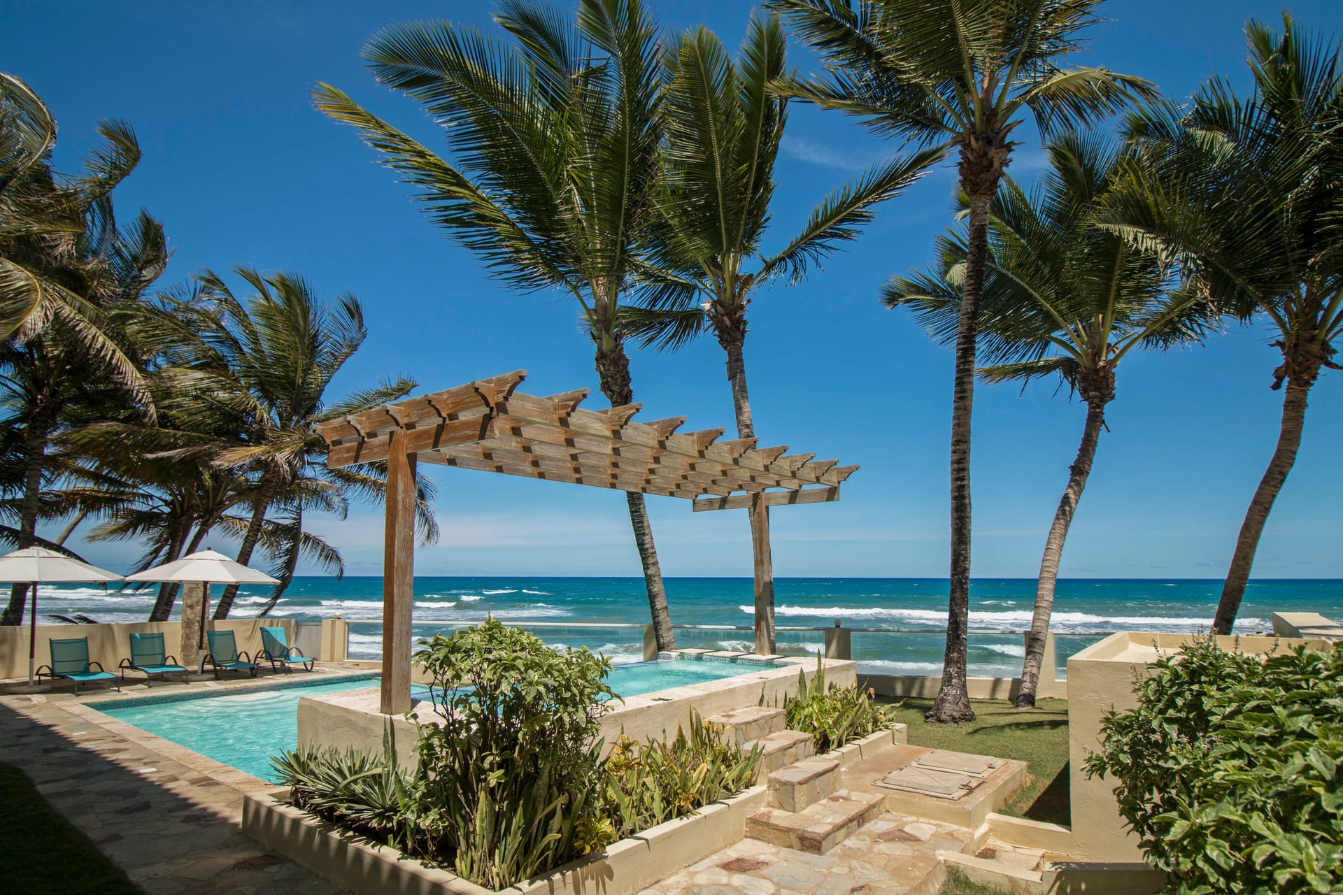 Pool area and ocean view at Beach Condos La Rinconada, Cabarete
